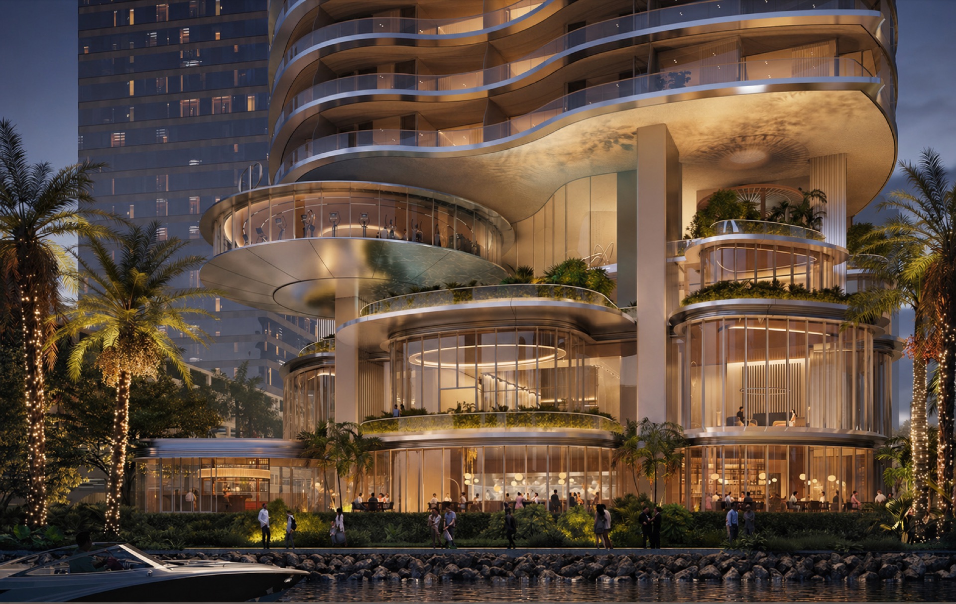 Bayfront tower lit at night with cascading balconies and dining